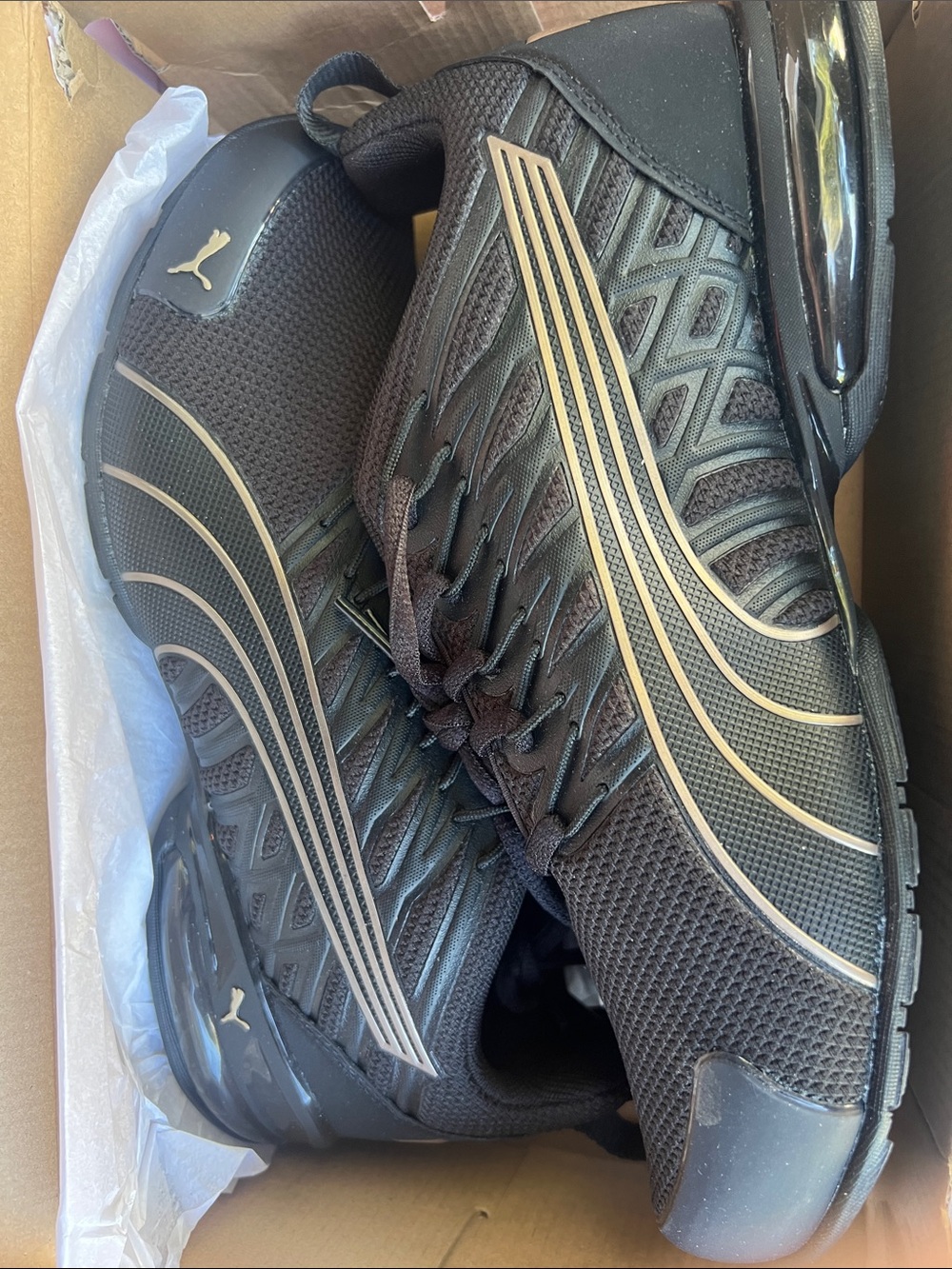 Puma Woman’s Black Athletic Sneakers with Gold Accents